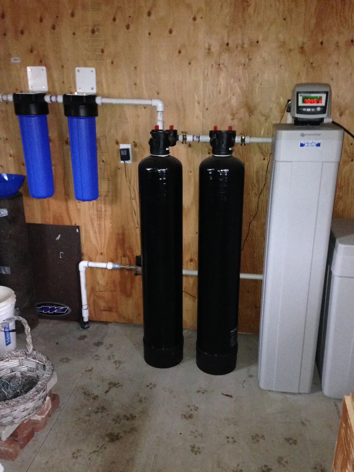Whole-home catalytic carbon pair with point-of-entry prefilters.
