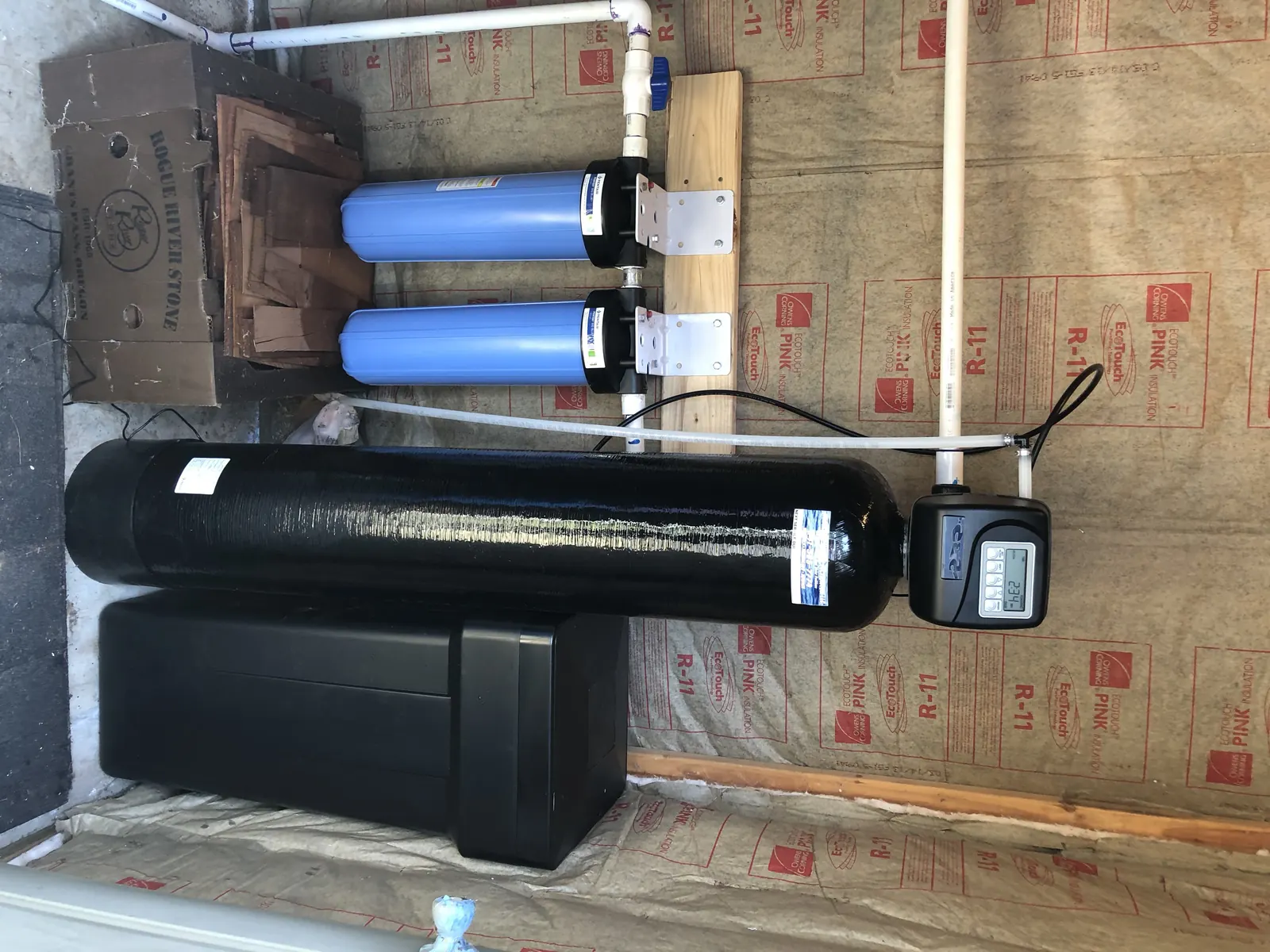 Single-tank softener install with sediment prefilter stage.