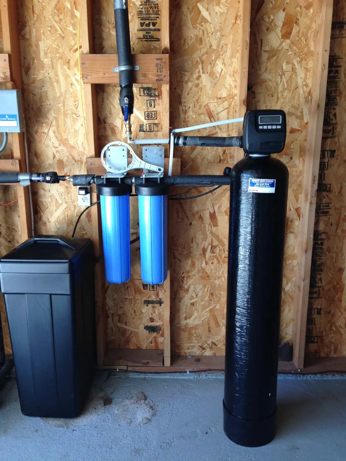 Whole-home carbon tank with dual sediment prefilters and UV polish.